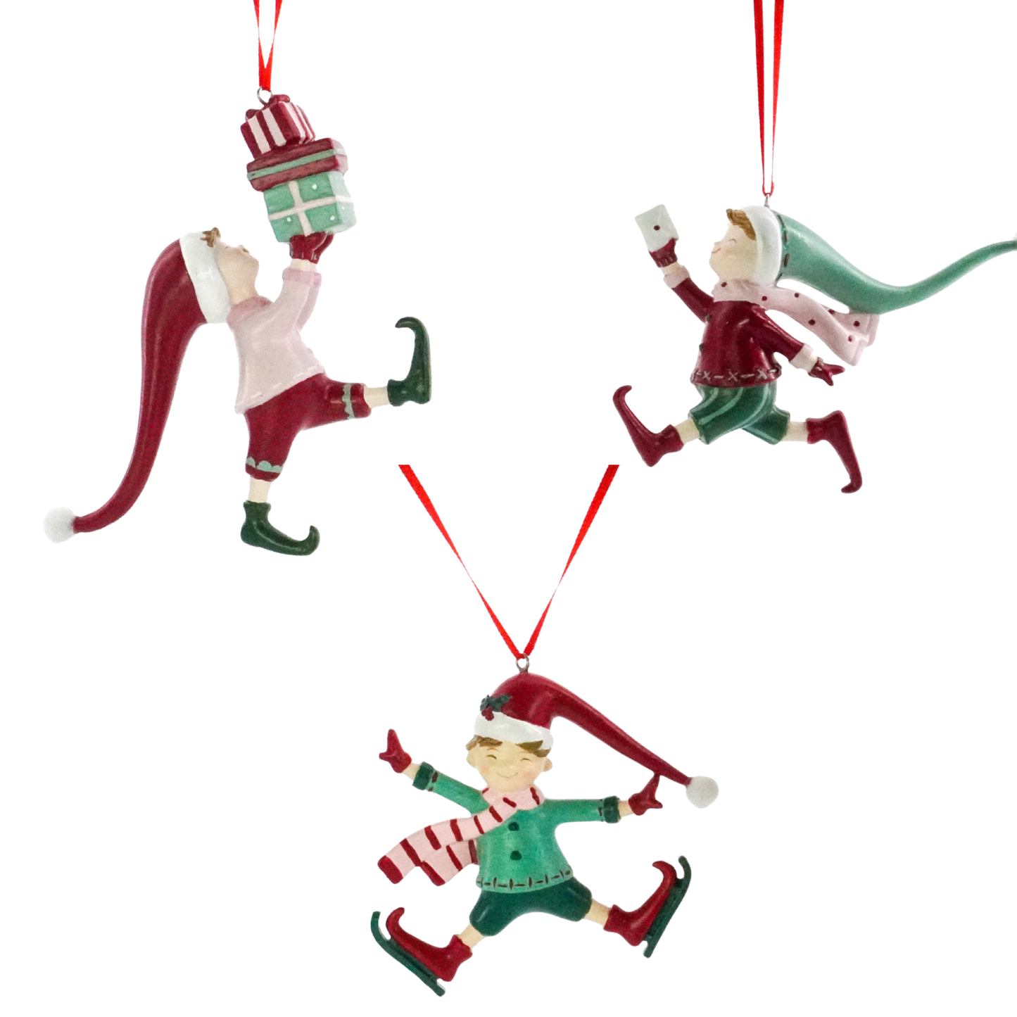 Set of three Christmas elf tree decorations — balancing gifts, running with a letter, and ice skating