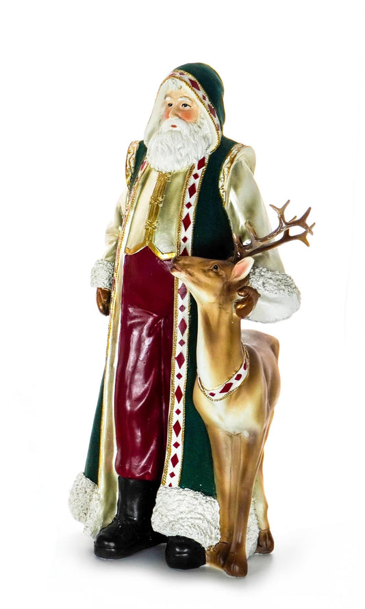 Santa figurine in a green and gold robe standing beside a reindeer with red and gold accents
