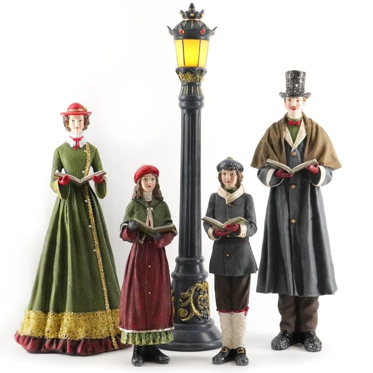 Victorian caroller figurine set of four with a light-up street lamp, each holding carol books in period costume