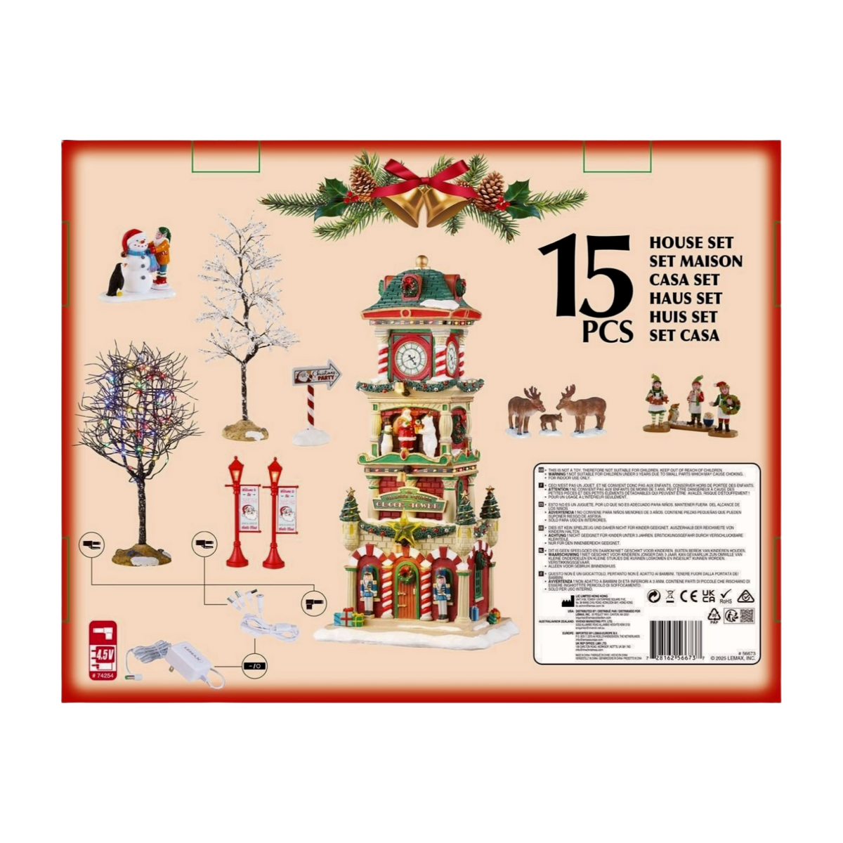 Rear of Lemax 15-piece village set packaging showing all included pieces: clock tower, trees, elves, reindeer, lamp posts, and power adaptor 