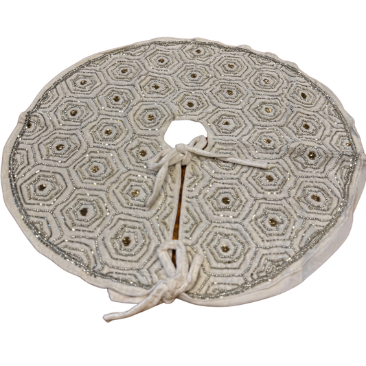 White velvet Christmas tree skirt with silver hexagon beaded design