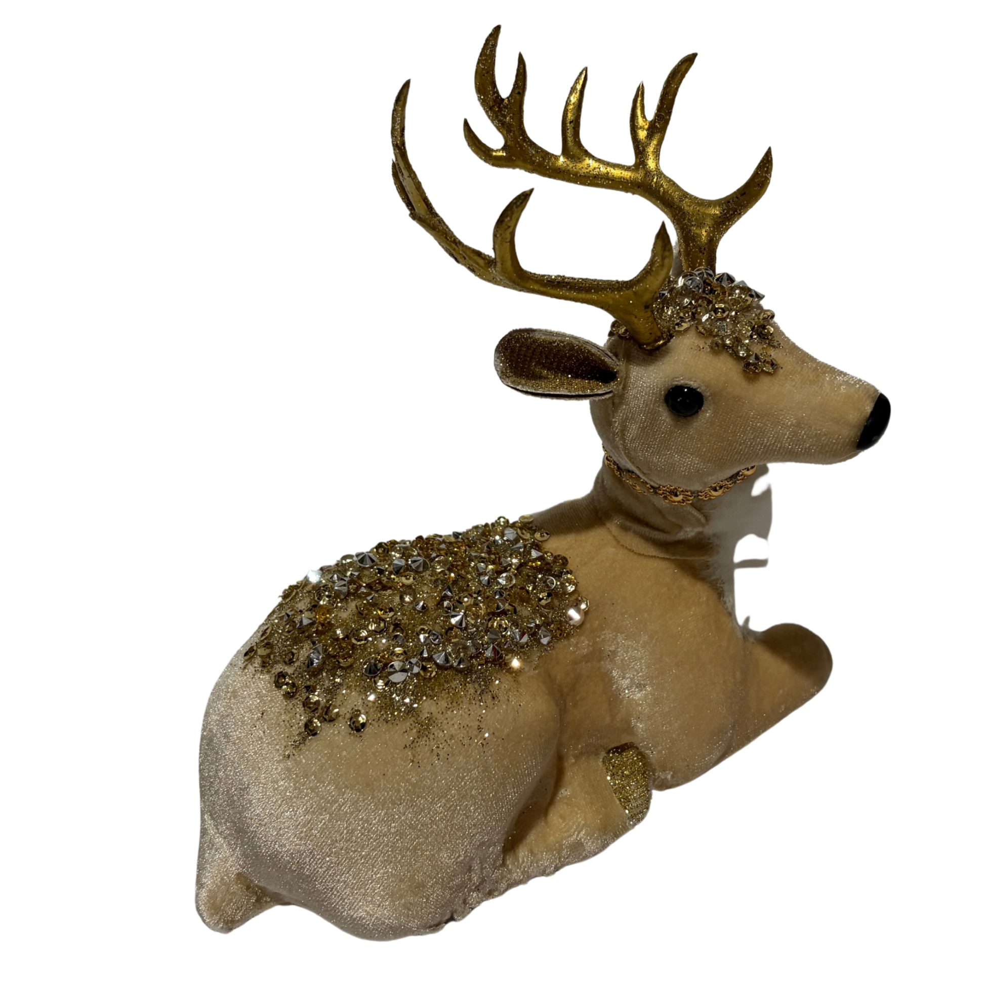 White reindeer figurine lying down with gold antlers and sparkling gold embellishments