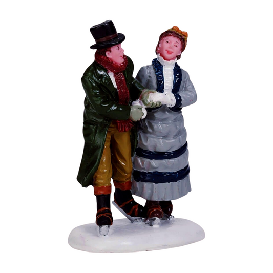 Lemax Victorian couple ice skating figurine — man in top hat and green coat, woman in grey dress, holding hands