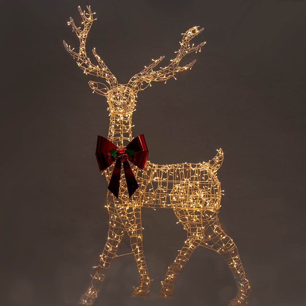 Gold wire reindeer LED light figure with red bow, lit with warm white lights